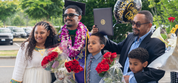 graduating student and family